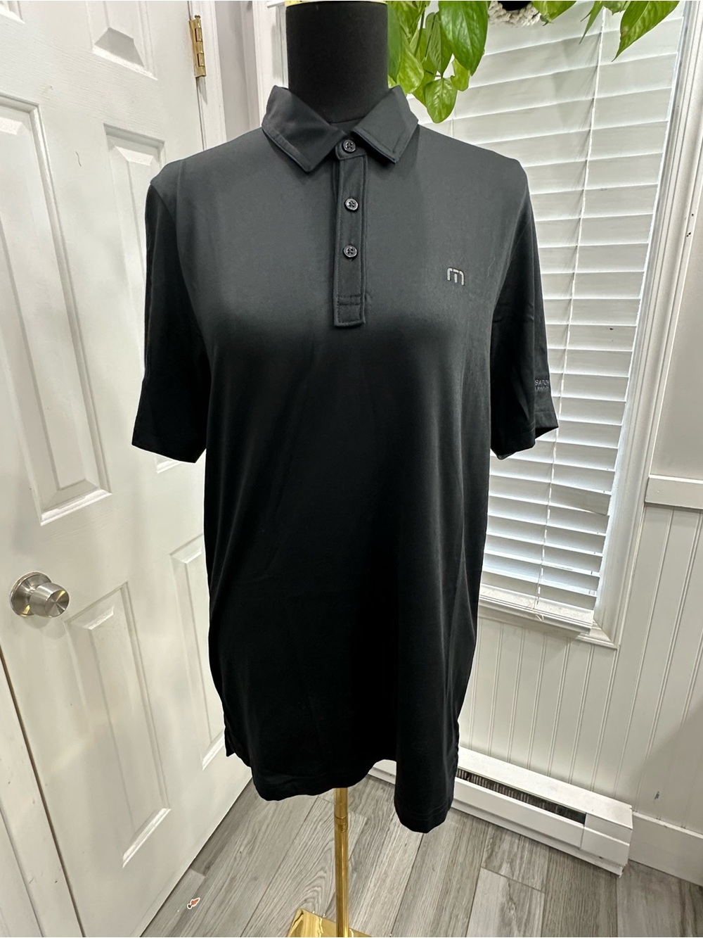 Travis Mathew Men's Black Polo with Subtle Chest Emblem